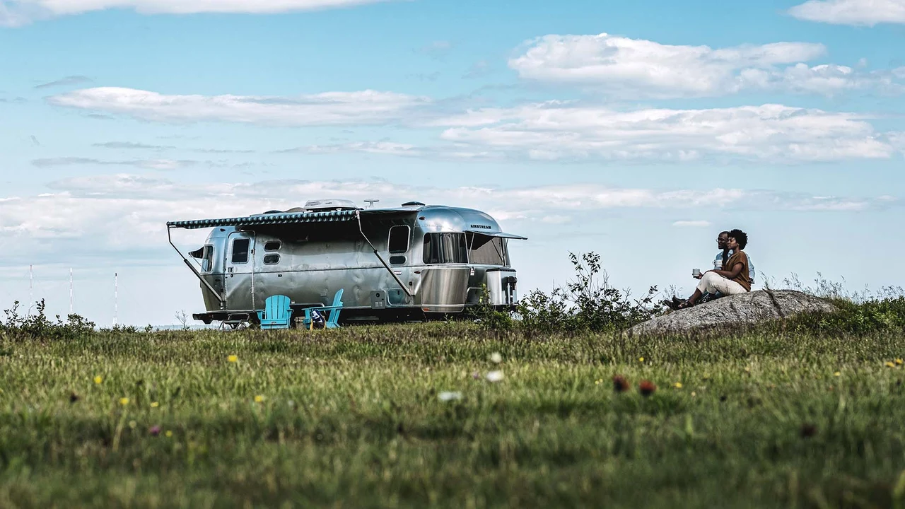An Airstream travel trailer at golden hour